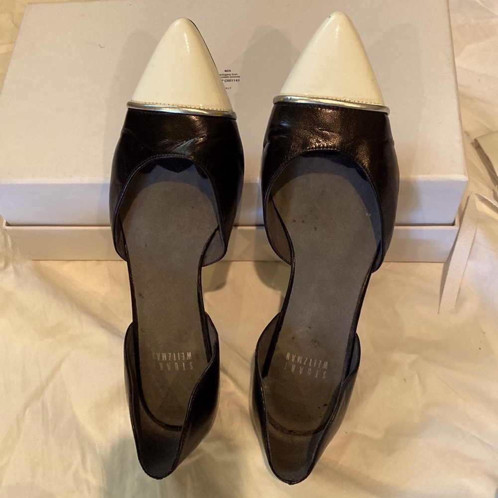 D’Orsay black flat with white patent toe.